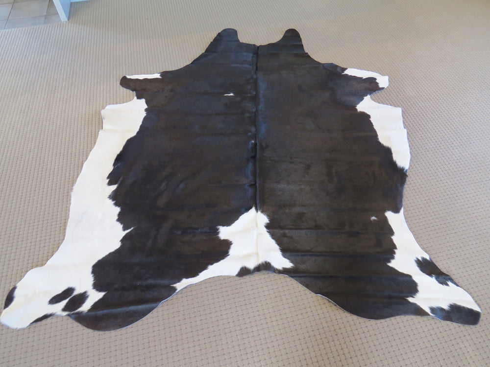 
            
                Load image into Gallery viewer, Large Cowhide - Black Brown + White
            
        