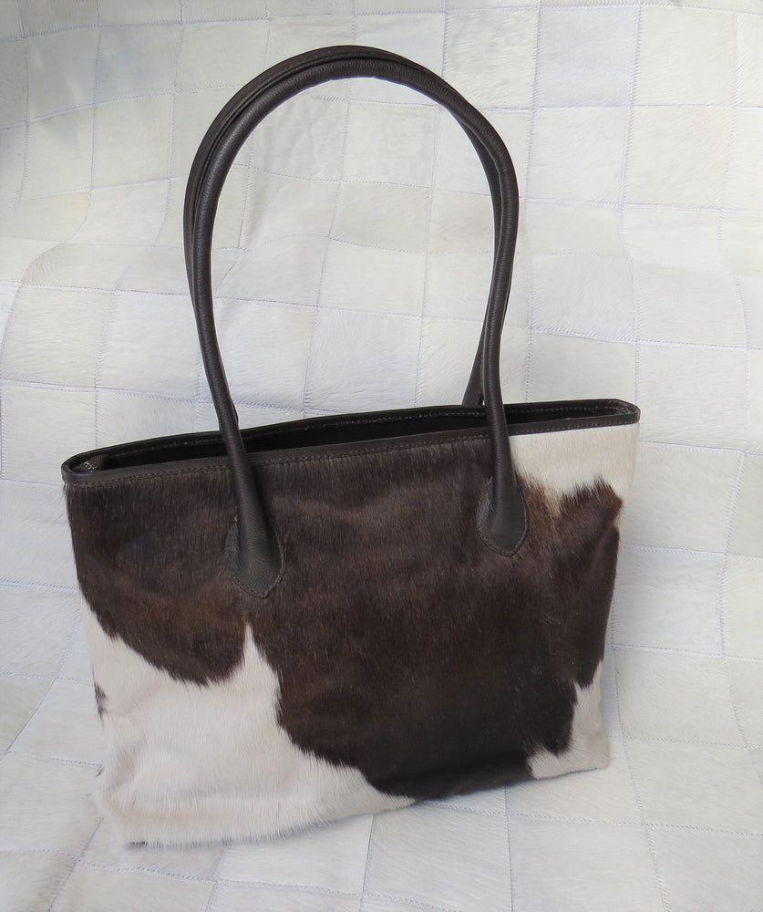 
            
                Load image into Gallery viewer, Coastal Cowhides Tote Bag - brown and white bold markings
            
        