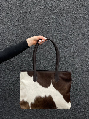 
            
                Load image into Gallery viewer, Coastal Cowhides Tote Bag - brown and white bold markings
            
        